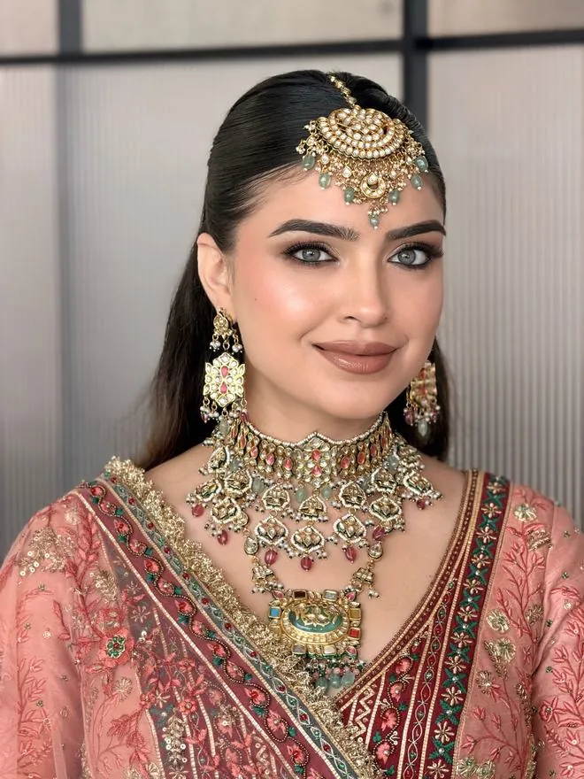 Red bridal look with veil and soft waves