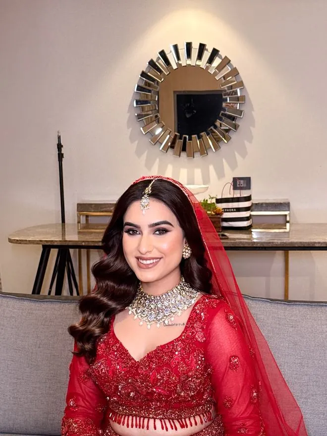 Red bridal look with soft waves