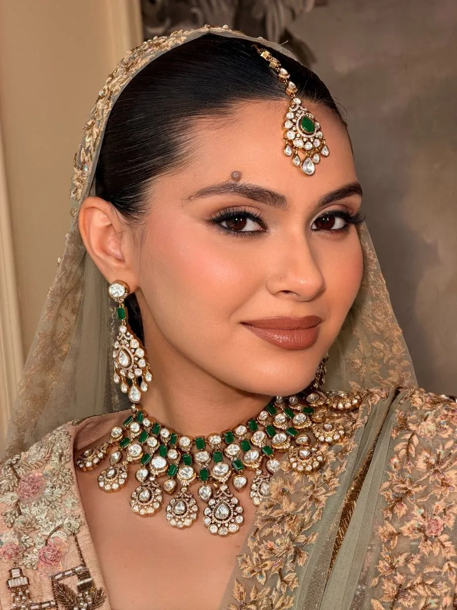 Bridal makeup by Meher Sehgal — emerald choker and soft glam